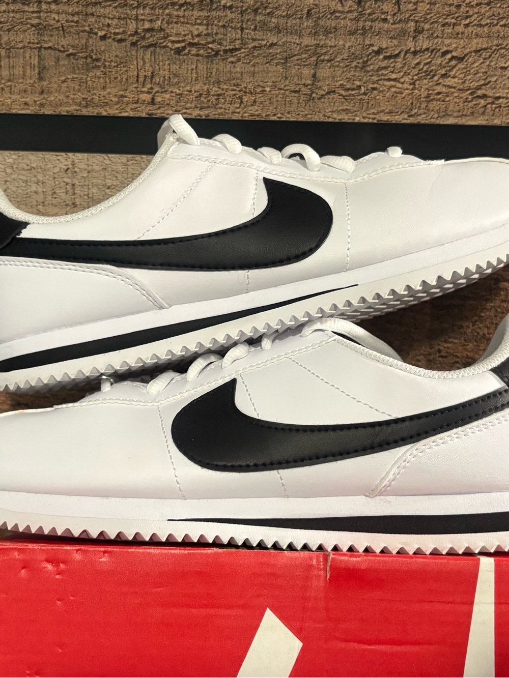 Nike Men’s White Leather Sneakers with Black Swoosh
